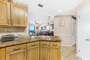Updated Kitchen with Stainless Steel Appliances, Granite Counter Tops and a Breakfast Bar