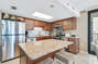Full Size Kitchen with Breakfast Bar and Granite Counter Tops