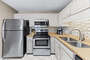 Updated Fully Equipped Kitchen with Granite Countertops and Stainless Steel Appliances