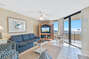 Spacious Living Room offers Comfortable Seating, Beachfront Views and Balcony Access