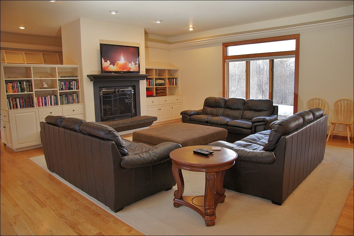 The main living room has a large HDTV and gas fireplace