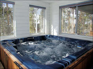 Private Indoor Hot Tub with windows for letting in the cool mountain air.