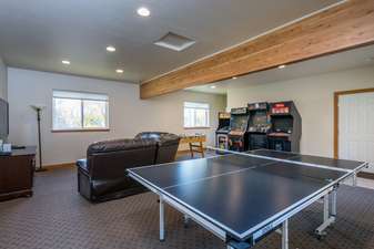 Game Room with arcade games, foos ball, ping pong, and HDTV with video game systems
