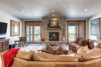 Large gas fireplace & access to the covered deck