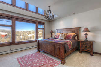 Spacious master with King bed and 2 story windows