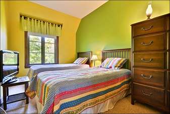 Colorful Third Bedroom Offers Two Twin Beds