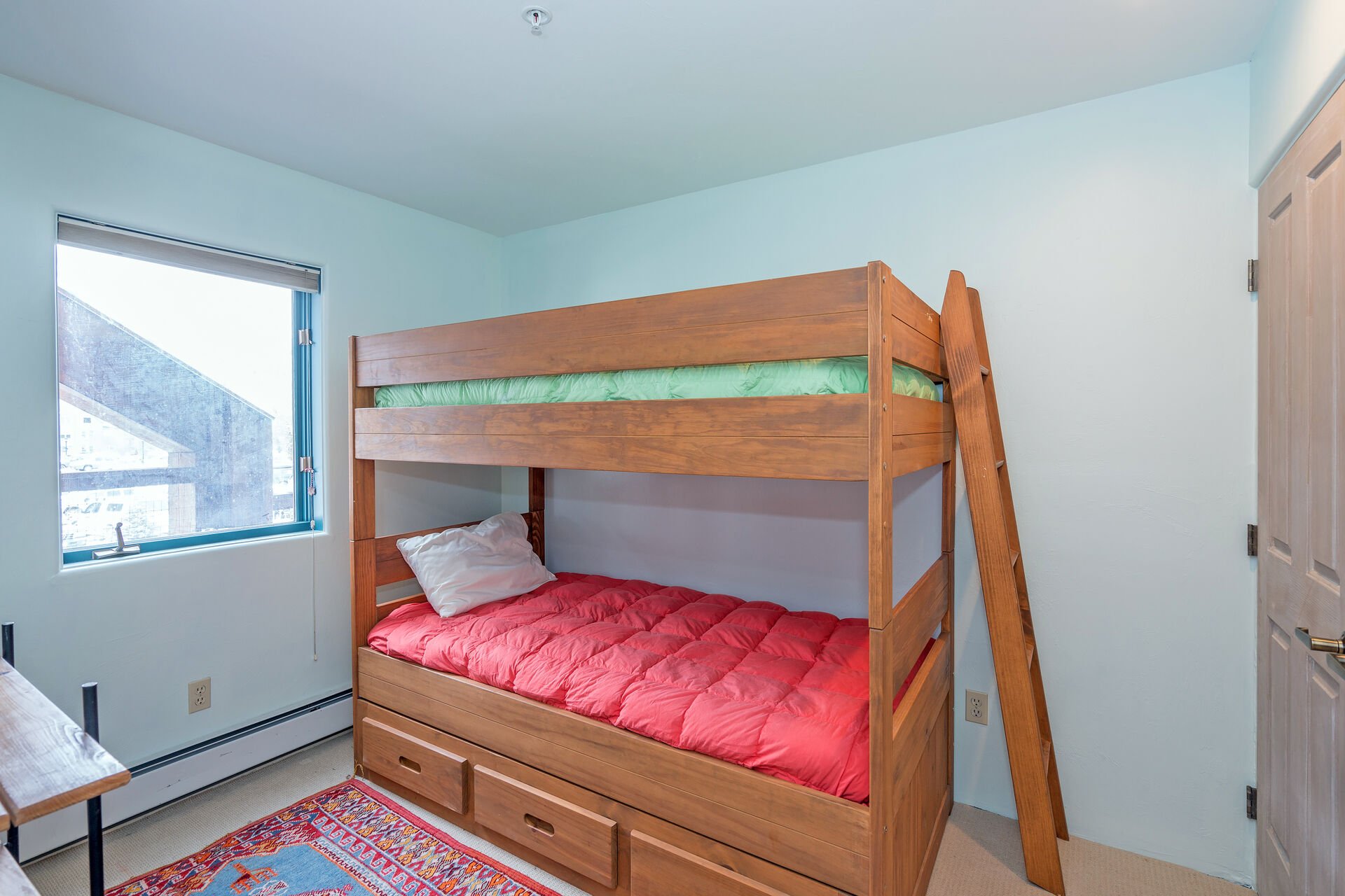 The 3rd bedroom is for the kids! A twin bunkbed with underneath storage for any toys you bring