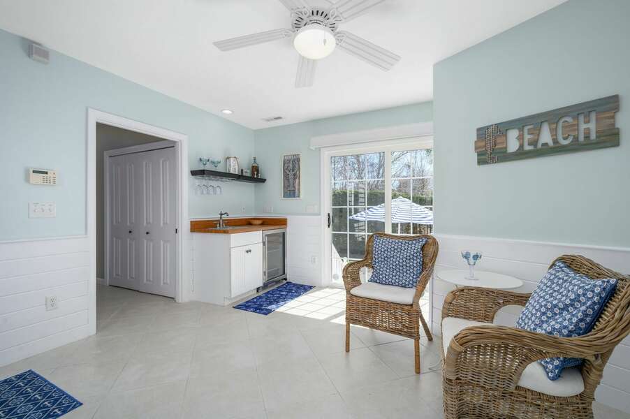 Entry area hallway to main level bedroom and living spaces as well as convenient wet bar near outdoor access - 9 Wilfin Road South Yarmouth Cape Cod - Four Shore - NEVR