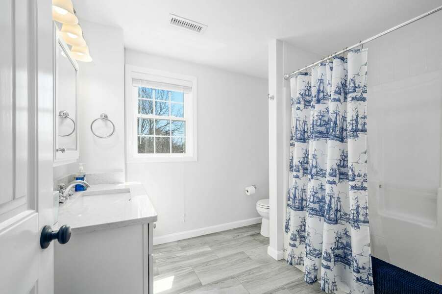 Upper level full bathroom with tub/shower combination - 9 Wilfin Road South Yarmouth Cape Cod - Four Shore - NEVR