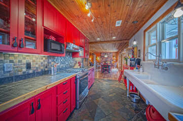 Spacious Kitchen Features Red Cabinets.