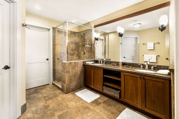 Walk-in shower and vanity sink of the Main ensuite bathroom.