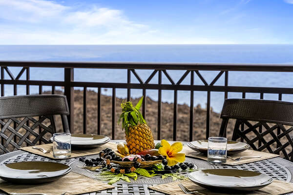 Fruit sits on the middle of the lanai table.