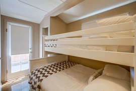 Second bedroom with twin and full bunk beds.