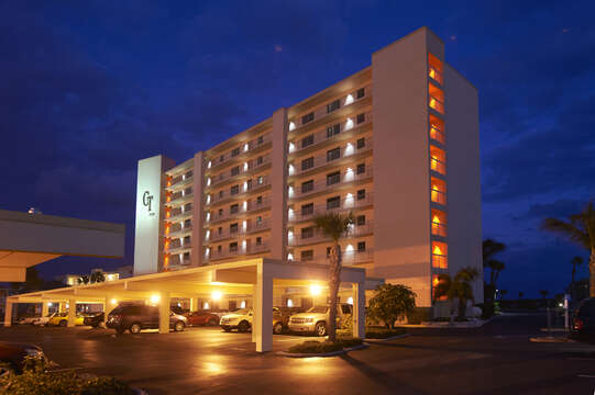 Canaveral Towers at night. You have a private covered parking spot & there is additional parking for your guests