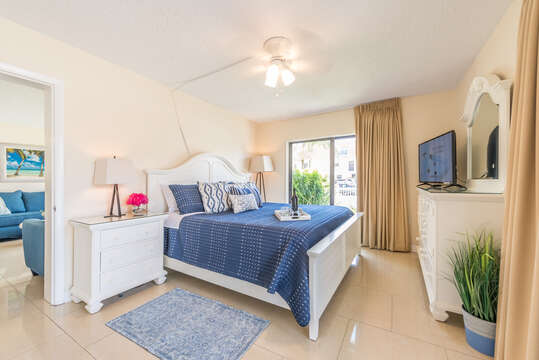 Serene master bedroom with a King Bed, flatscreen TV, ensuite and walk in closet.