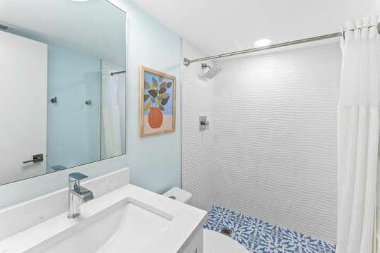 Coastal Casual downstairs bathroom with shower