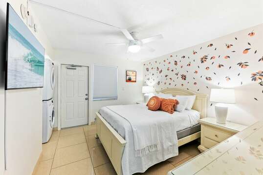 Tropical guest bedroom with queen bed, 55