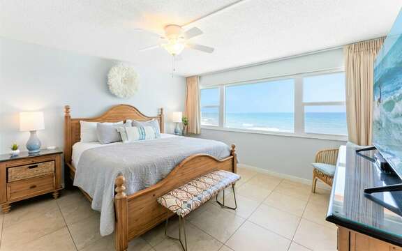 Master Bedroom #2 with King bed, TV, ensuite & stunning view of the ocean