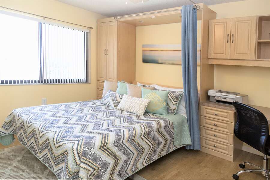 Guest bedroom with Murphy bed & office that easily lifts into the wall with one hand!