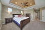 Bedroom with two nightstands and a ceiling fan
