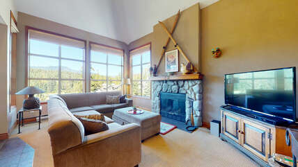 Living Room w/ Wood Burning Fireplace & Smart TV