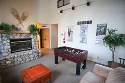 Game room with foosball table in central building amenities area