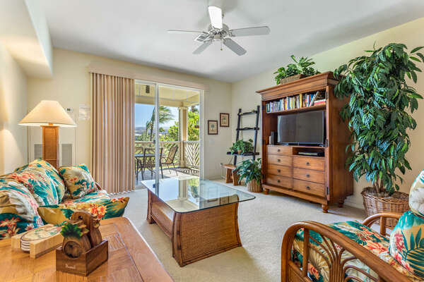 Living Area with Flat-screen TV, Lanai Access, and Seating at Waikoloa Hawaii Vacation Rentals