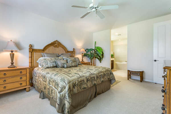 Large Bed with Wooden Headboard and Ceiling Fan at Fairway Villas Waikoloa C22