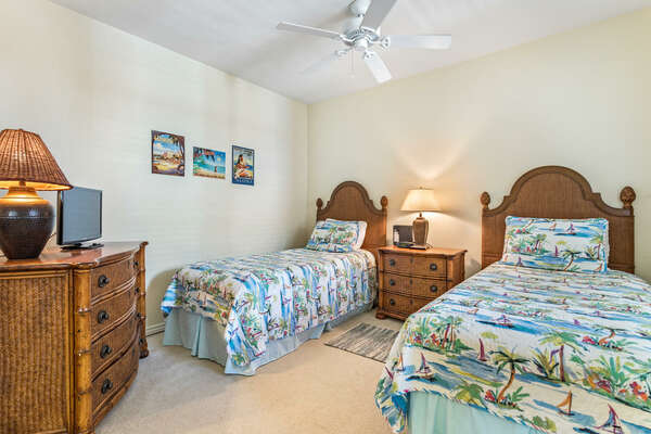 Bedroom with 2 Twin Beds, Tropical Decor, and TV at Waikoloa Hawai'i Vacation Rentals