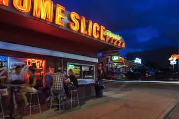 Nearly world famous Home Slice Pizza will satisfy your craving for pie.