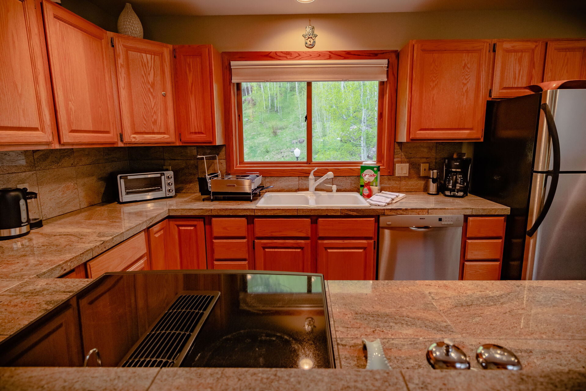 Full Kitchen with Wrap-Around Counter Tops and Stainless Steel Appliances at Colorado Vacation Cabin
