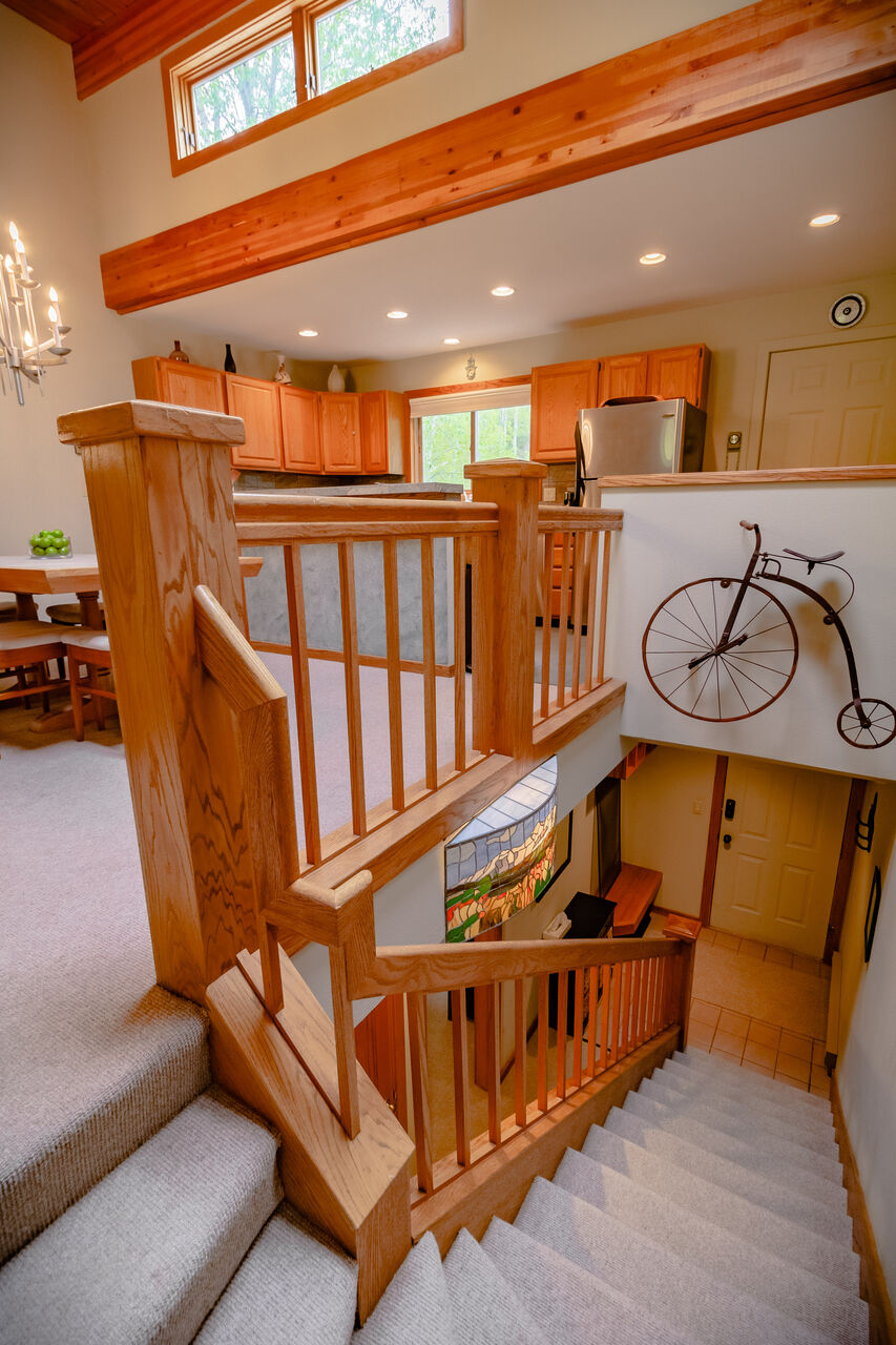 Staircase with Bicycle Wall Art Leading to the Lower Level