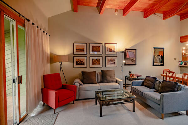 Living Area with High Ceilings and Wood Cross Beams