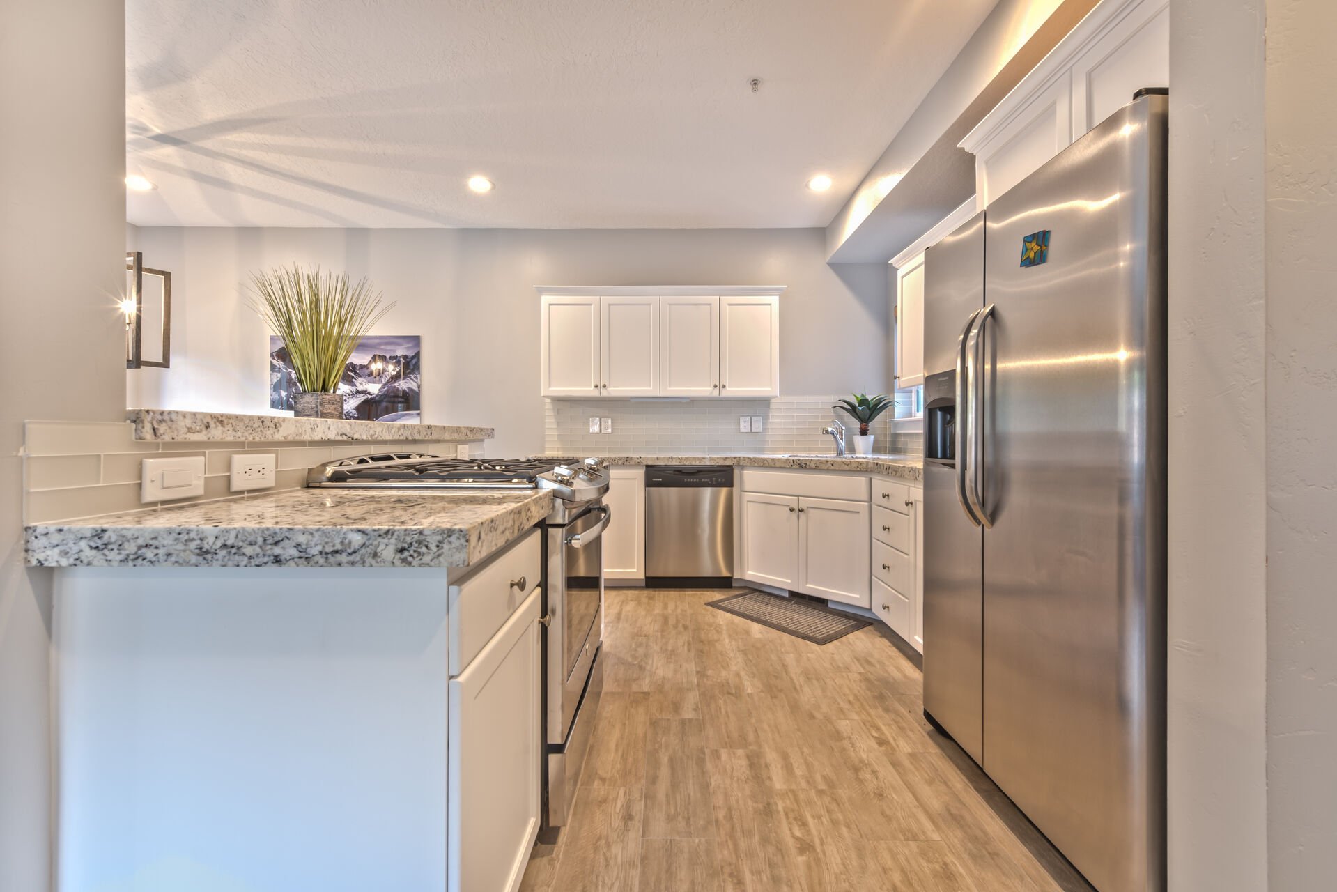 All New Fully Equipped Kitchen with High-end Finishes, Stainless Steel Appliances, and a 5-Burner Gas Range