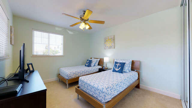 Upstairs Bedroom with Nautical Theme and Flat Screen TV