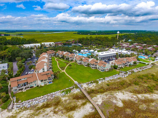 Aerial View from the beach looking back at the John Fripp Villas and The Beach Club pools