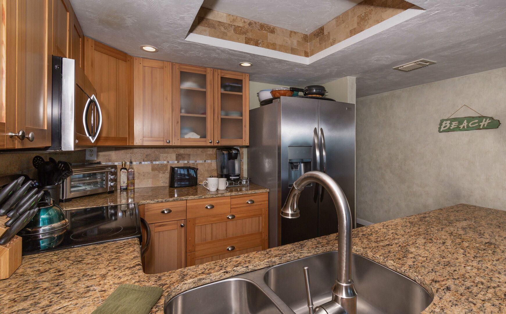 Kitchen with stainless steel appliances and granite countertops.