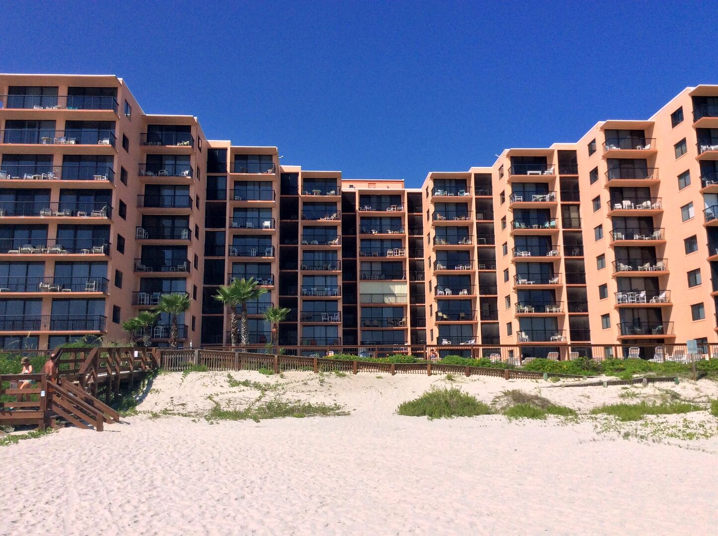 Sunrise Condominiums, home of this vacation condo in New Smyrna Beach, from the beach.