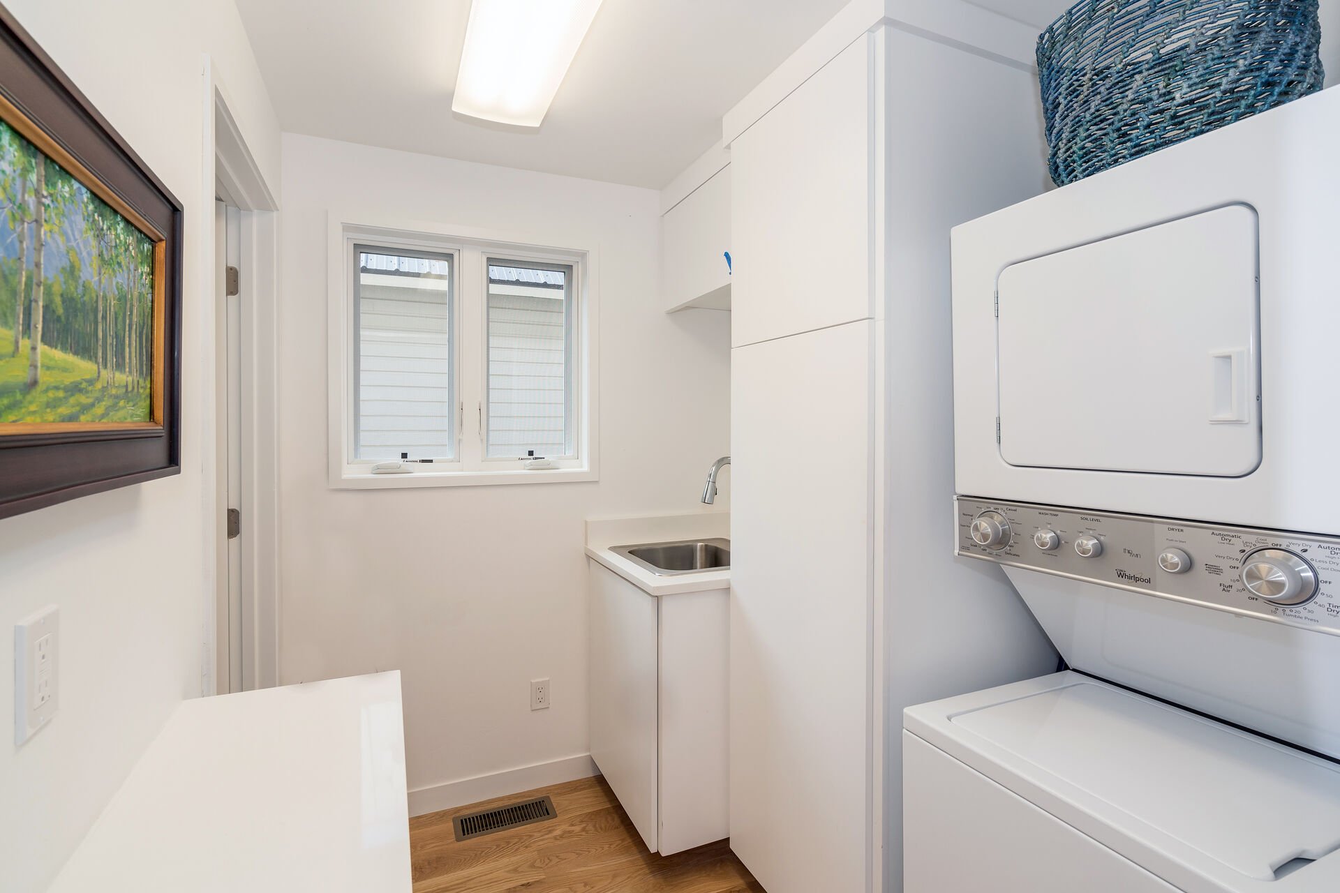 Laundry Room with Stacked Washer and Dryer