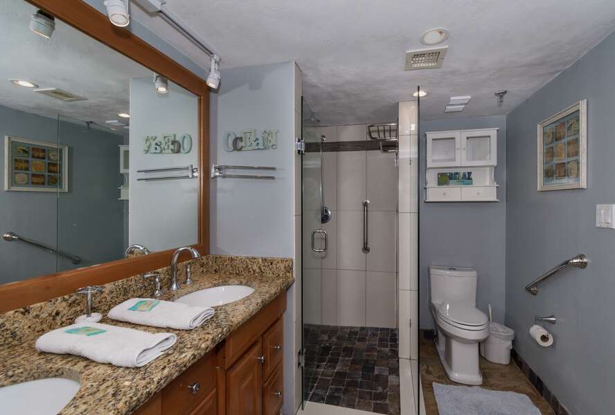 Vanity bathroom with large sink and walk-in shower.