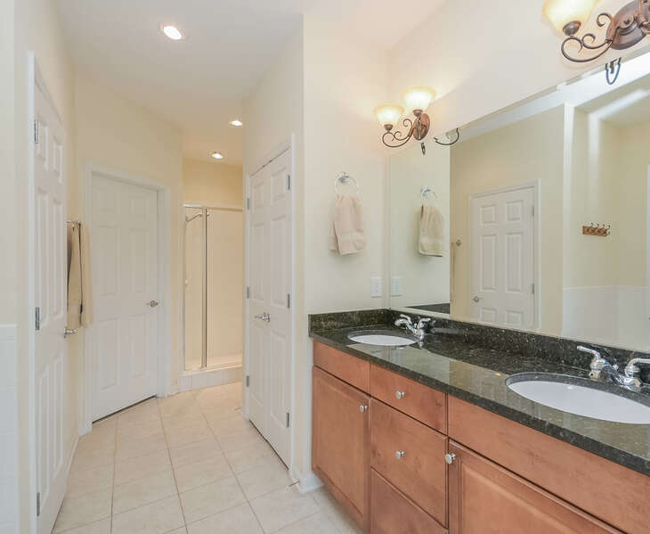 Master bath with double sinks and walk-in shower.