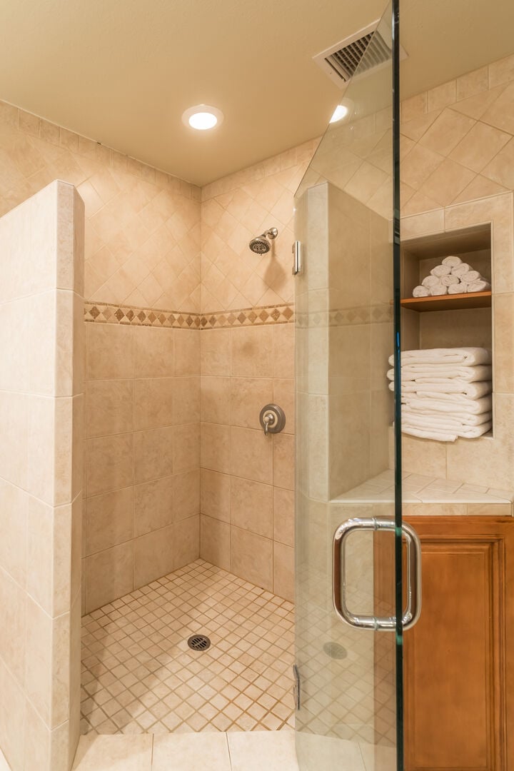 A custom built shower in the master bedroom is huge and ready to spell relaxation for you!