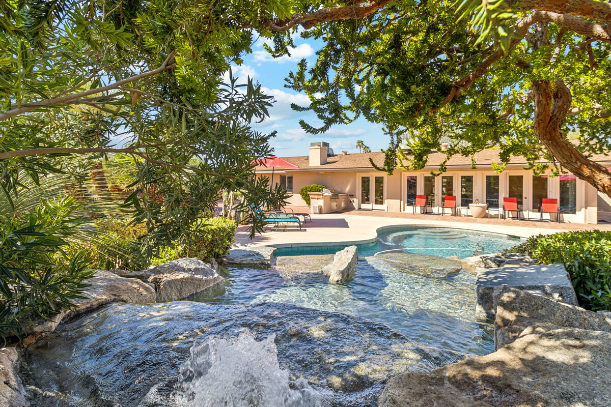 Resort style (heated optional) pool with tranquil waterfall.