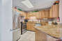 Fully Equipped Kitchen with Breakfast Bar, Granite Countertops and Stainless Steel Appliances