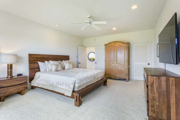Large Bed, Armoire, Smart TV, and Ceiling Fan