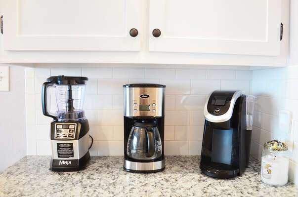 Ninja blender, Keurig, coffee maker and more!  Our dry bar provides everything you need to have a good time!  We provide a few k-cups and coffee grounds to get you started, sweet 'n low and sugar too!