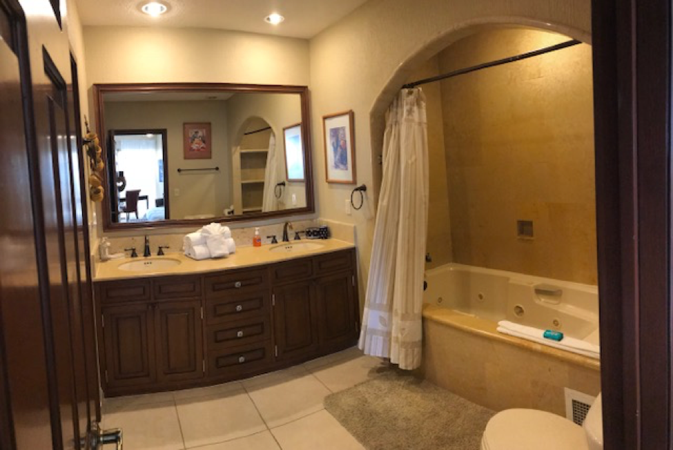 The large master bathroom features dual sink vanities, large jetted tub and large walk-in closet. Beautiful coastal woodwork ensures that you are always in a state of relaxation.