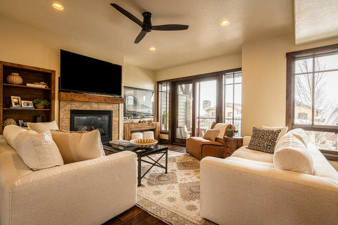 Main Level Living Room with Comfortable Modern Furnishings, Beautiful Hardwood Floors, Gas Fireplace, 65