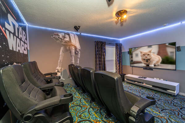Movie theatre room showing  flatscreen TV and movie seating