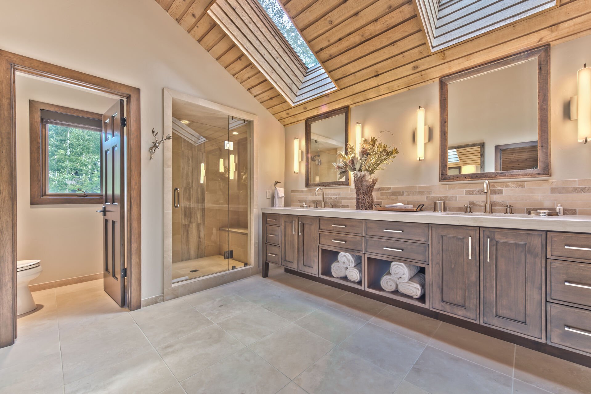 Grand Master Bathroom with Dual Sinks, Soaking Tub, and Large Stone Shower